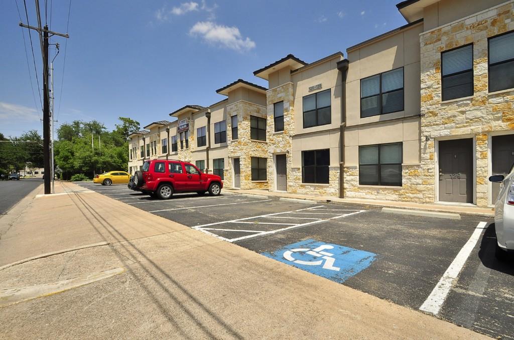 711 West 32nd Street, Unit 108 Austin, TX 78705 - Photo 3 of 28 a car parked in front of a building