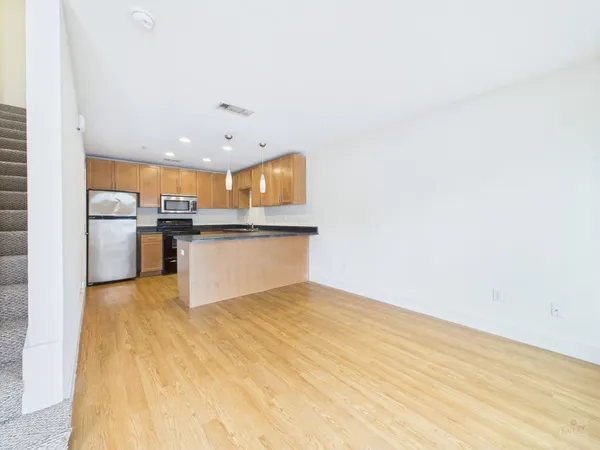 a view of kitchen with wooden floor
