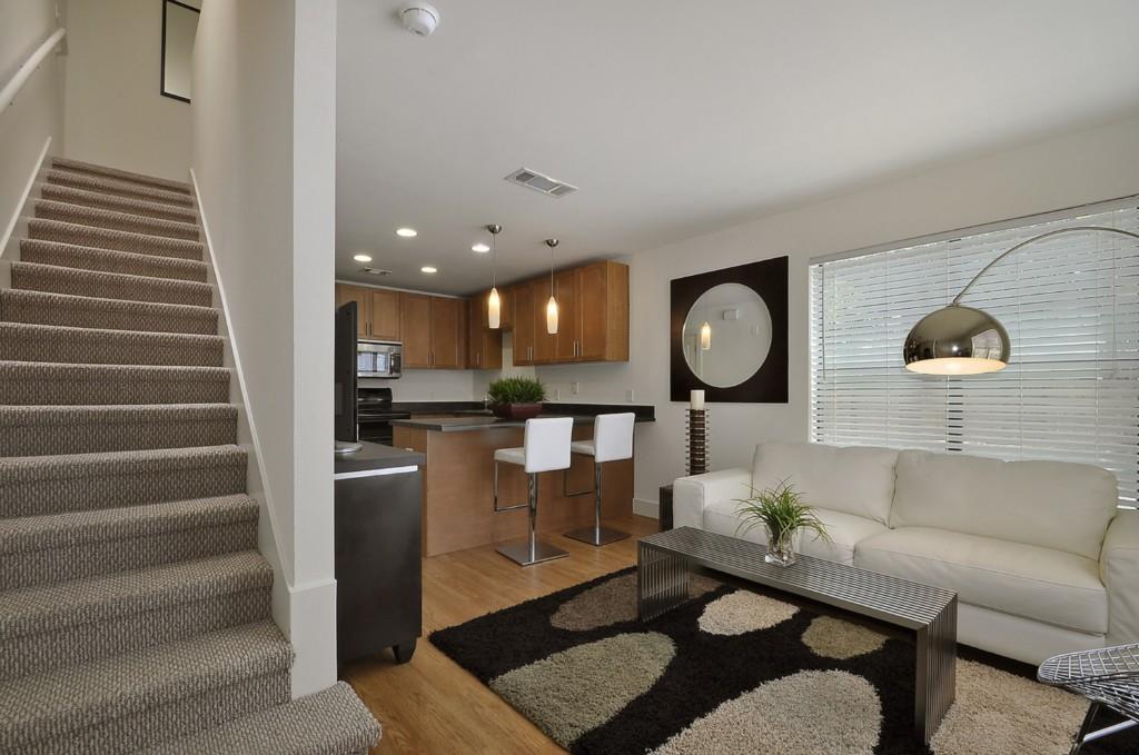 711 West 32nd Street, Unit 108 Austin, TX 78705 - Photo 6 of 28 a living room with furniture and wooden floor