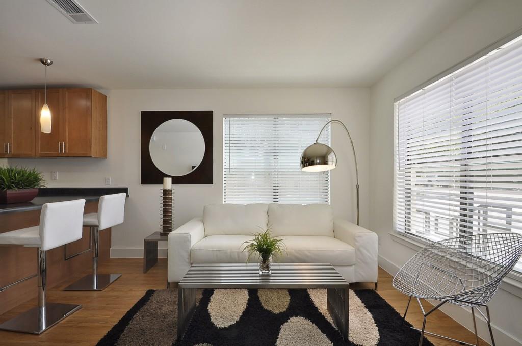 711 West 32nd Street, Unit 108 Austin, TX 78705 - Photo 7 of 28 a living room with furniture and a large window