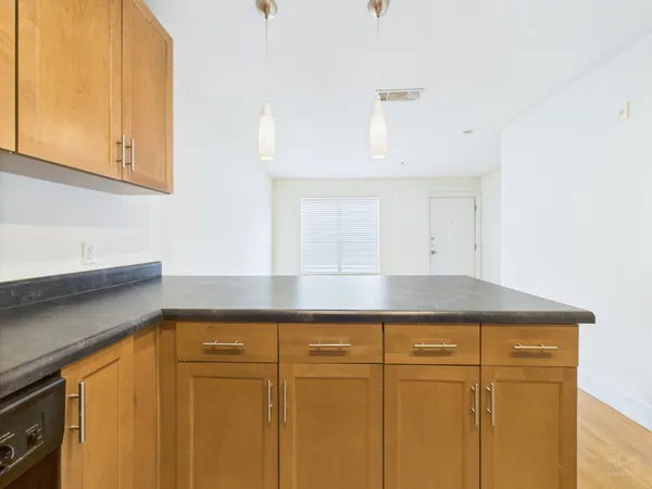 a kitchen with cabinets and a stove top oven