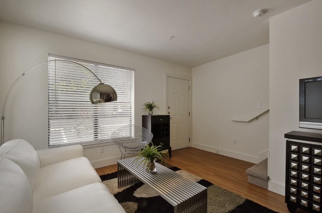 711 West 32nd Street, Unit 108 Austin, TX 78705 - Photo 10 of 28 a living room with furniture and a window