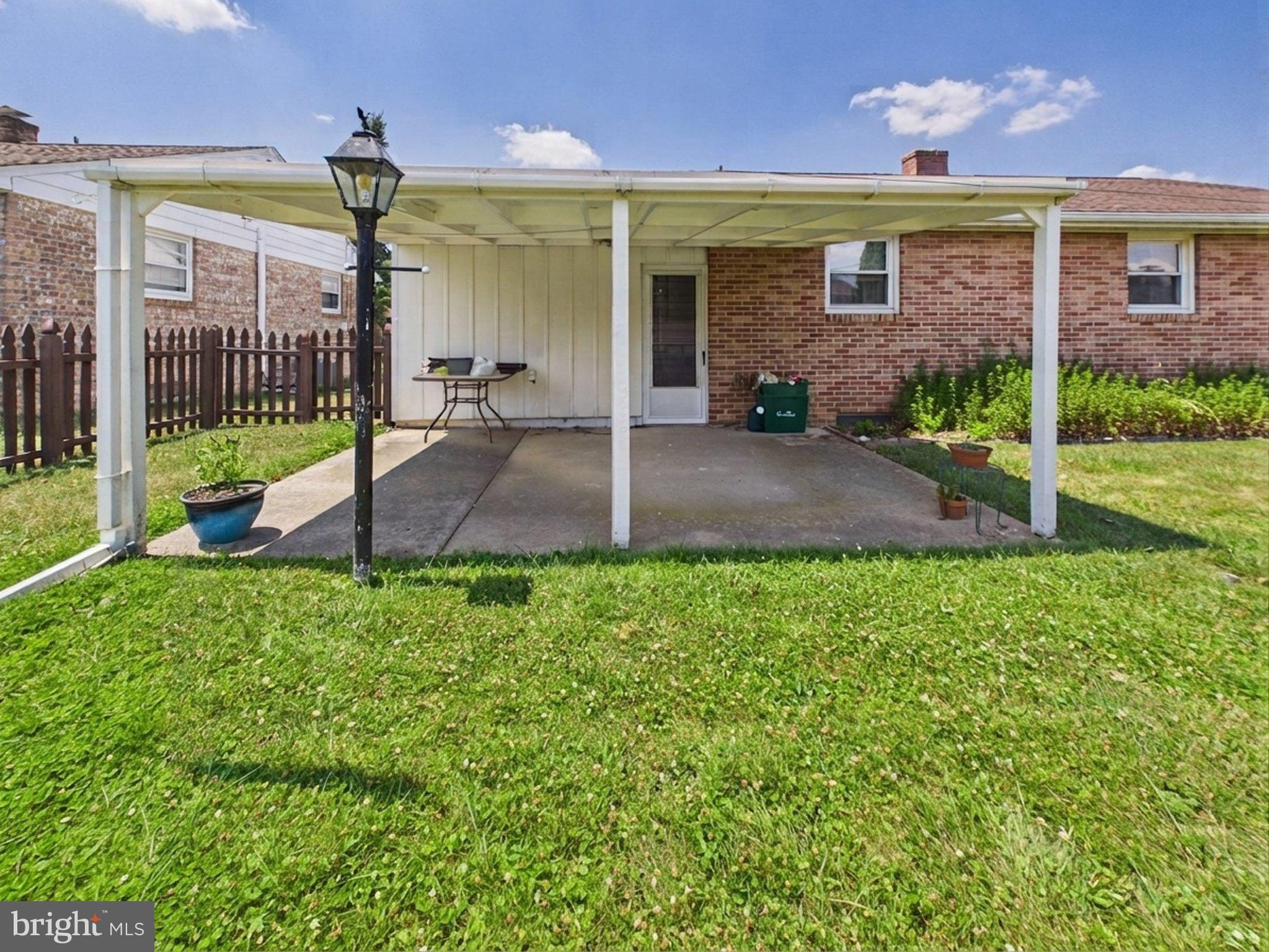 347 George Street Hanover, PA 17331 - Photo 7 of 42 Charming patio with lush greenery.