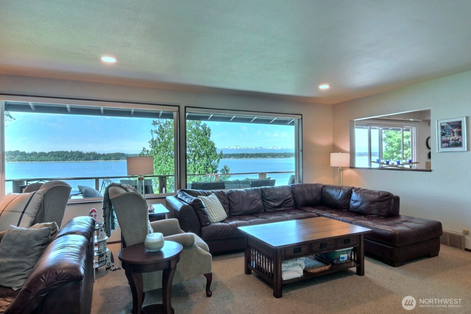 7504 Crescent Beach Rd Nortwest Vaughn, WA 98394 - Photo 11 of 40 a living room with furniture and a large window