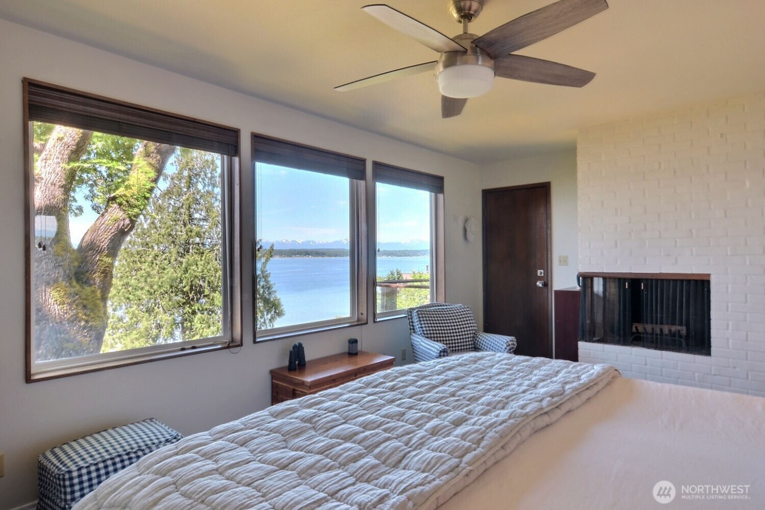 7504 Crescent Beach Rd Nortwest Vaughn, WA 98394 - Photo 16 of 40 a bedroom with a large bed and a large window