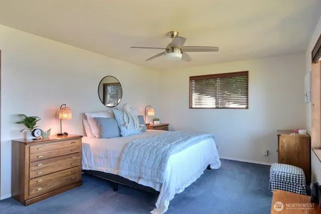 a bedroom with furniture and flat screen tv