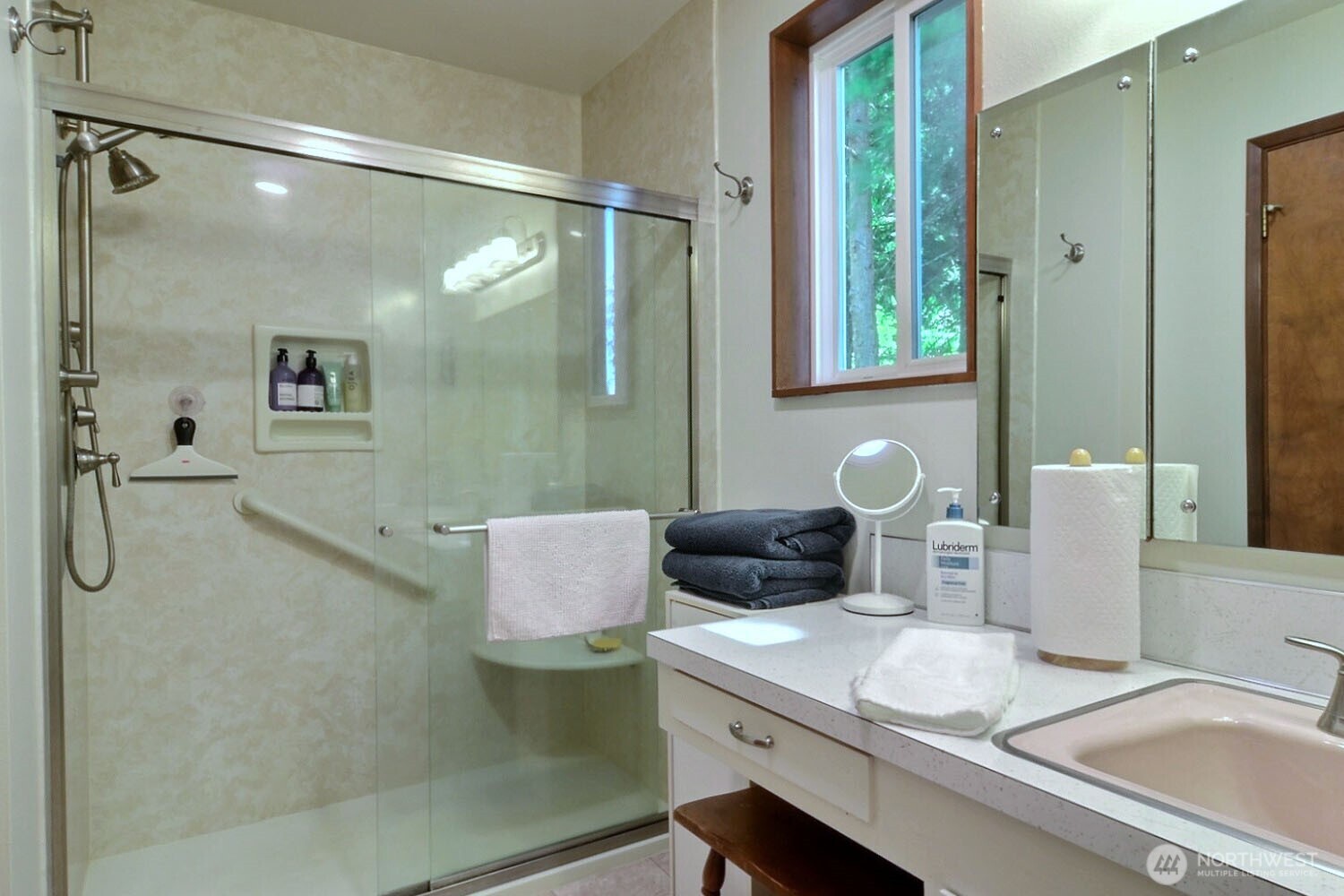 7504 Crescent Beach Rd Nortwest Vaughn, WA 98394 - Photo 18 of 40 a bathroom with a granite countertop sink a shower and a mirror