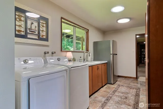 a bedroom with a bed and a painting on the wall