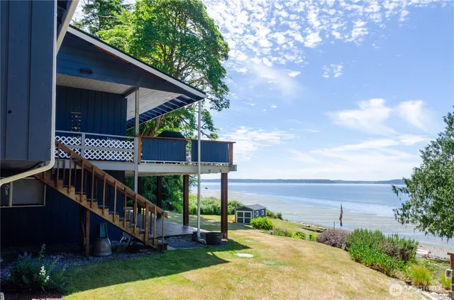 a front view of a house with a garden