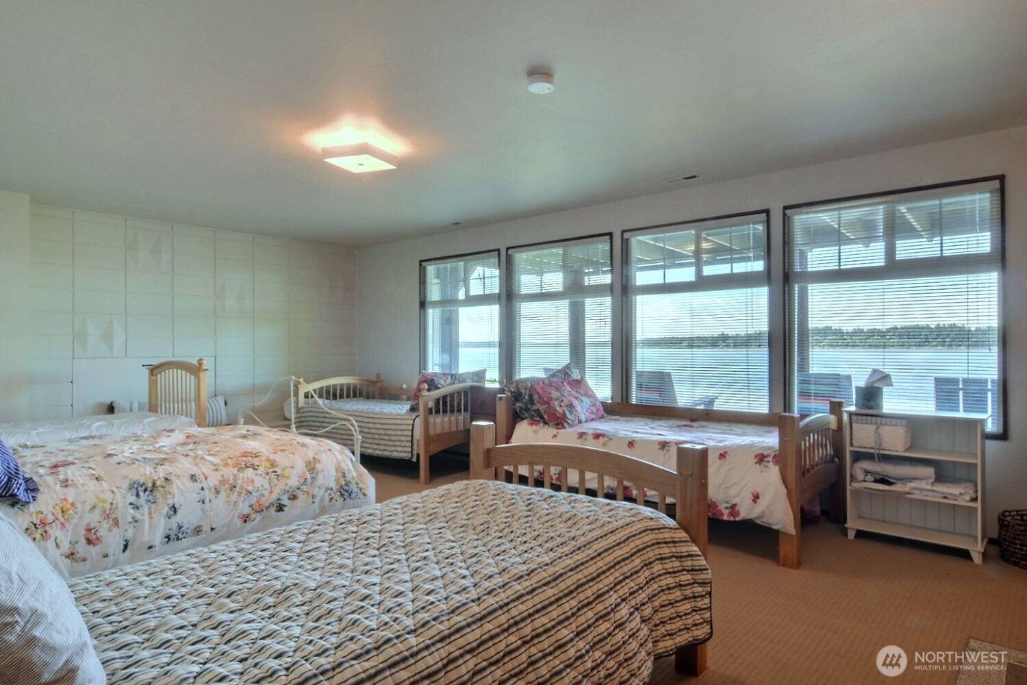 7504 Crescent Beach Rd Nortwest Vaughn, WA 98394 - Photo 22 of 40 a bedroom with two beds and large windows