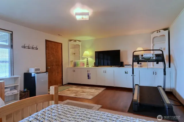 an aerial view of a house with yard basket ball court and outdoor seating