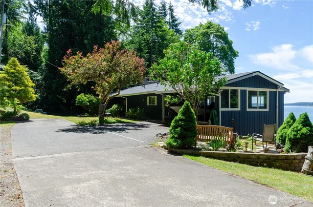a kitchen with stainless steel appliances granite countertop sink stove and table