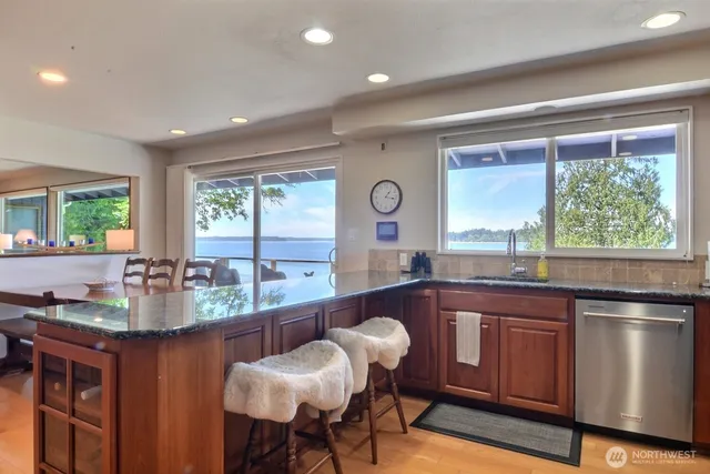 a view of a dining room with furniture window and outside view