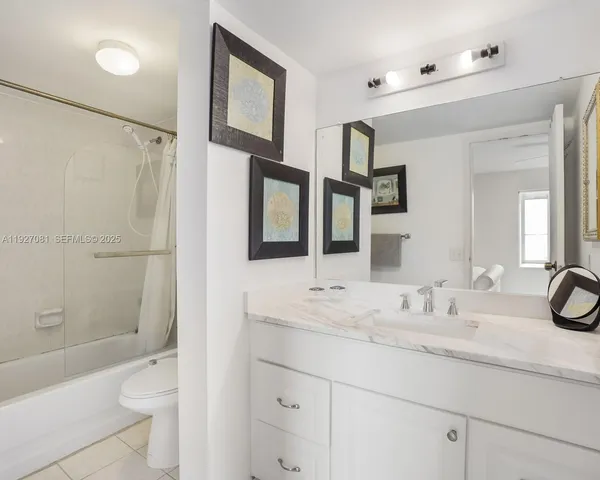 a bathroom with a shower and a toilet