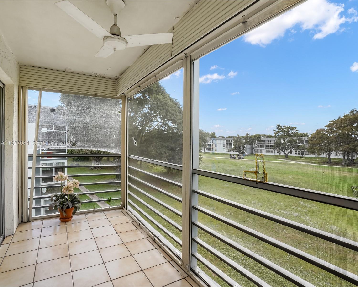 8320 Sands Point Boulevard, Unit M301 Tamarac, FL 33321 - Photo 18 of 36 a view of a porch with a bench