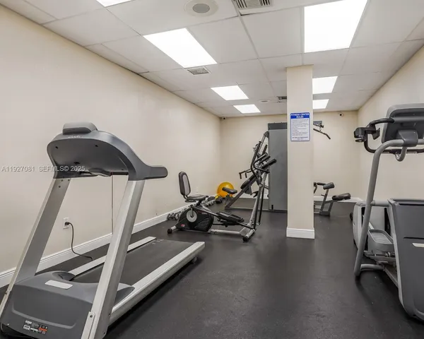 a outdoor space with pool table and chairs