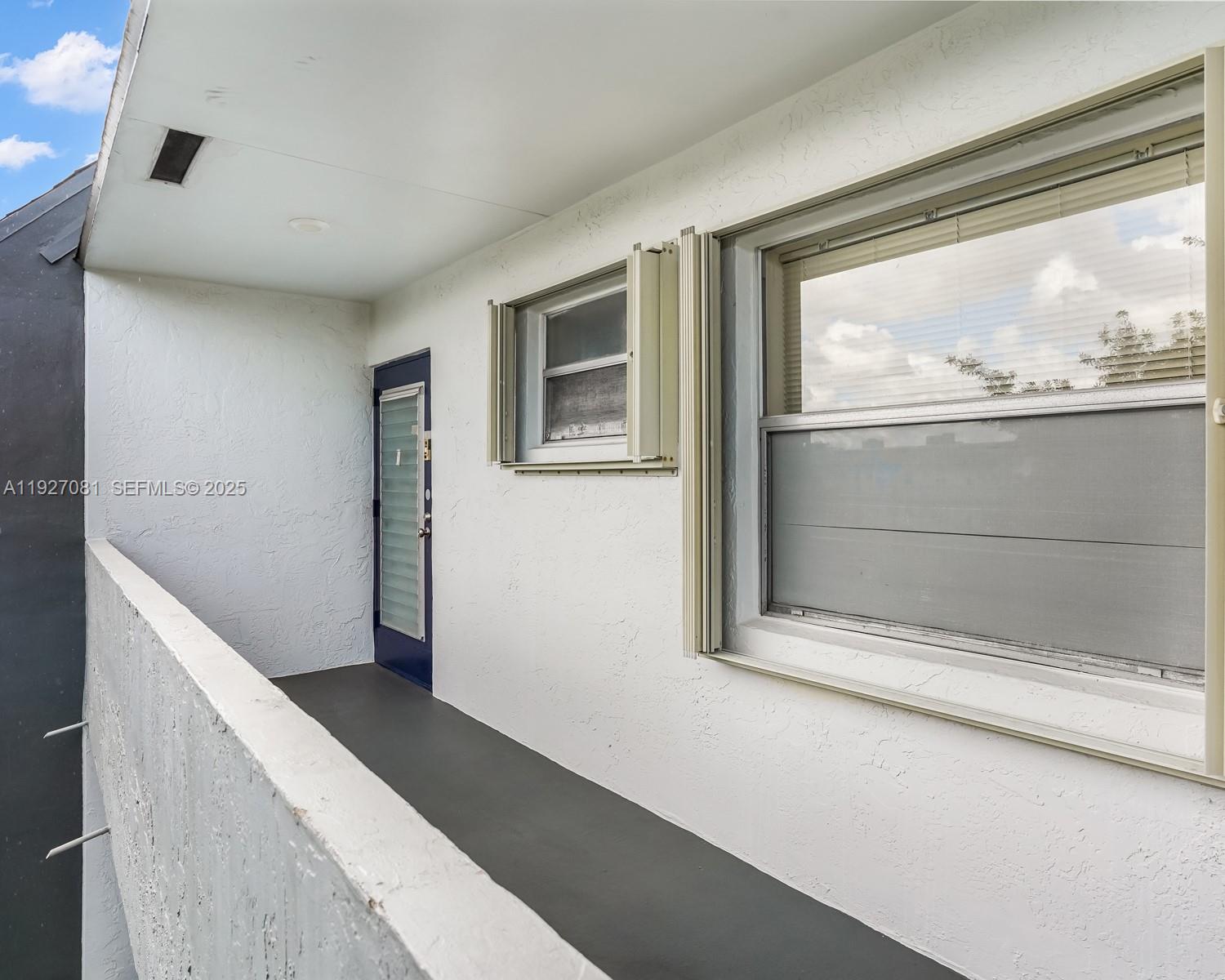 8320 Sands Point Boulevard, Unit M301 Tamarac, FL 33321 - Photo 34 of 36 a view of a living room with a large window