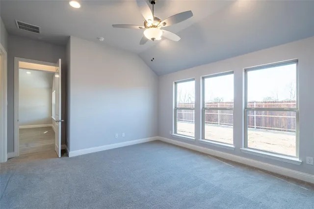 a view of an empty room with a fan