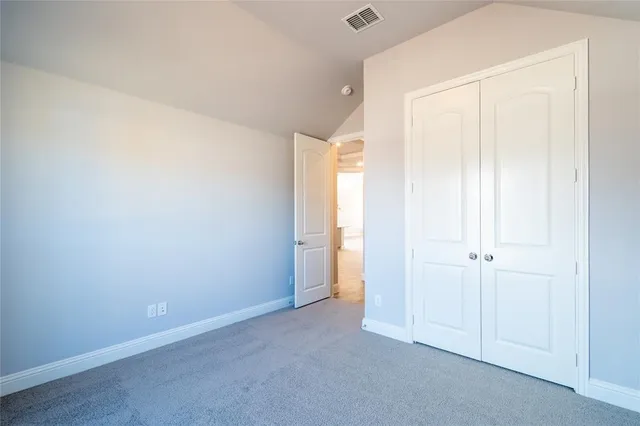 a view of a bathroom from a glass door