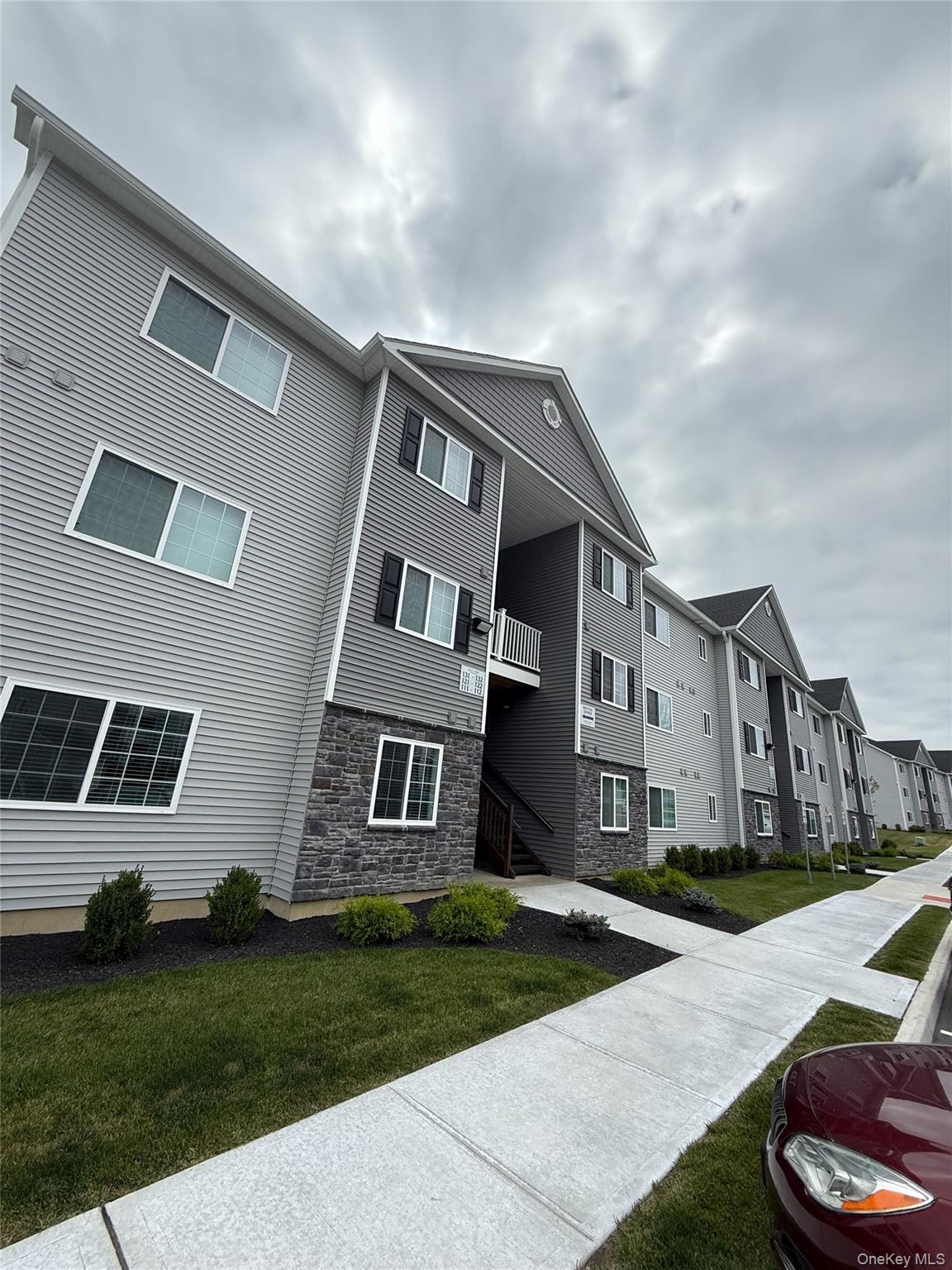 206 Golf Links Road, Unit 821 Middletown, NY 10940 - Photo 7 of 7 View of building exterior with a residential view