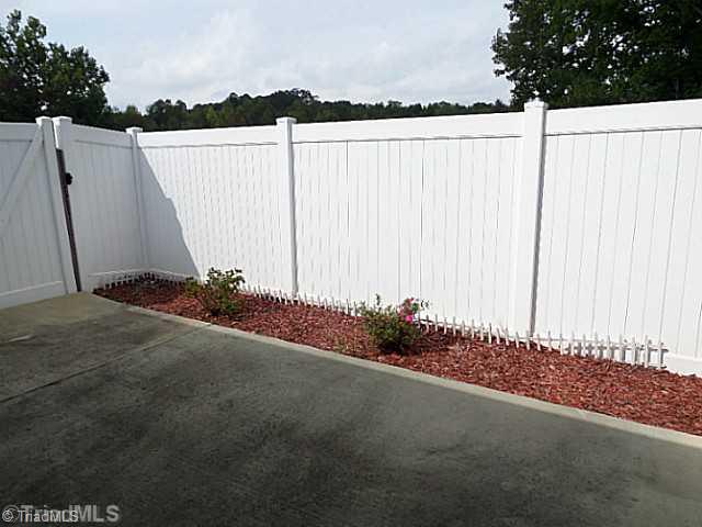 1452 Downington Road Clemmons, NC 27012 - Photo 16 of 16 Patio/Deck. Privacy fenced patio for grilling or chilling. There is a natural gas hookup for your grill too.