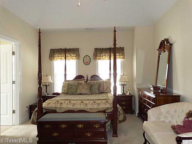 1452 Downington Road Clemmons, NC 27012 - Photo 7 of 16 Master Bedroom. Main level master bedroom has neutral decor and can hold an abundance of furniture. It features a tray ceiling and a ceiling fan. Steps away is the laundry area and coat & linen closet.