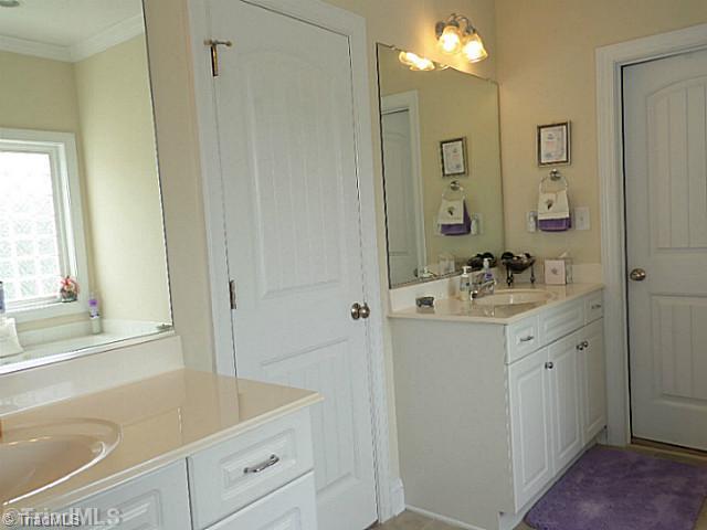 1452 Downington Road Clemmons, NC 27012 - Photo 8 of 16 Master Bath/Spa. Master bathroom has separate double sinks, tile floor, jetted tub, separate shower and a walk in closet.