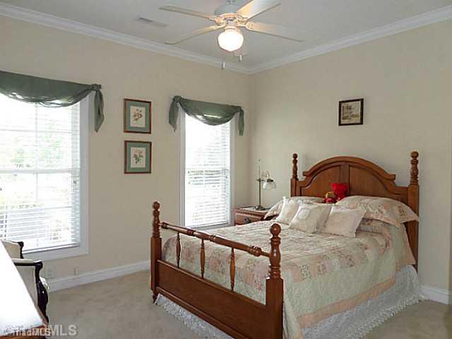 1452 Downington Road Clemmons, NC 27012 - Photo 9 of 16 2nd Bedroom. Front bedroom has crown molding, ceiling fan, double closet, and 2" blinds.