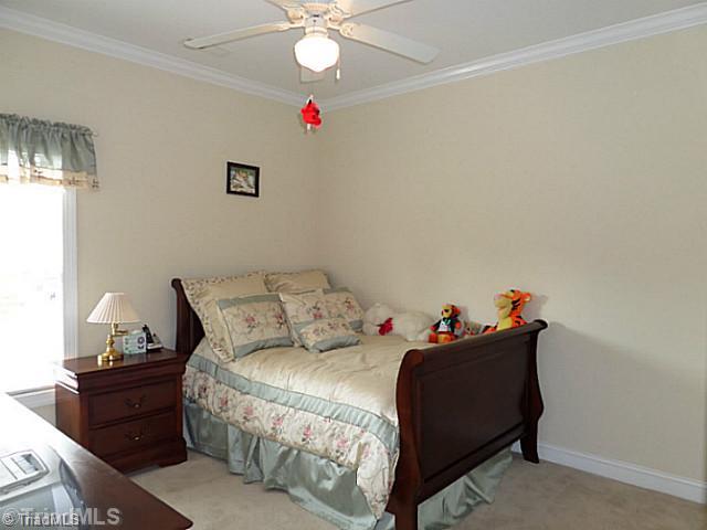 1452 Downington Road Clemmons, NC 27012 - Photo 10 of 16 3rd Bedroom. Main level third bedroom has crown molding, ceiling fan and a double closet.