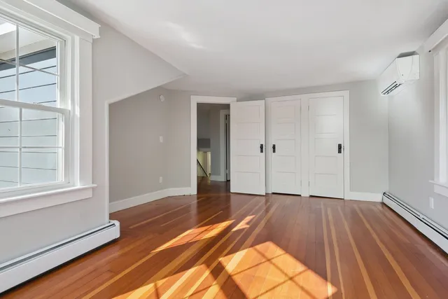 a bathroom with a sink a mirror and a shower