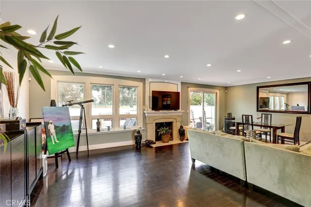 a living room with fireplace furniture and a flat screen tv