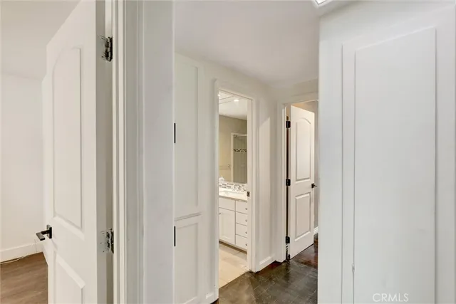 a view of a bathroom from a hallway