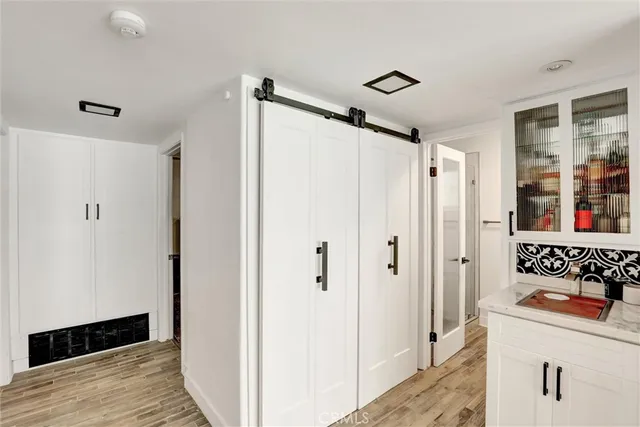 a bathroom with a shower and a sink