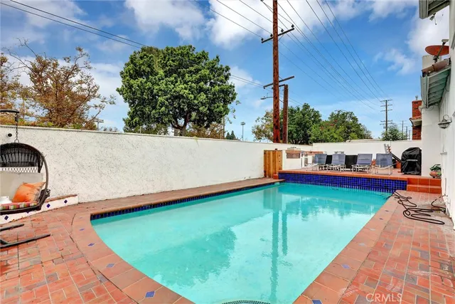 a view of a swimming pool with a patio