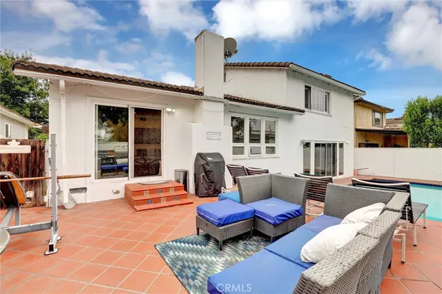 a outdoor space with patio couches and a potted plant