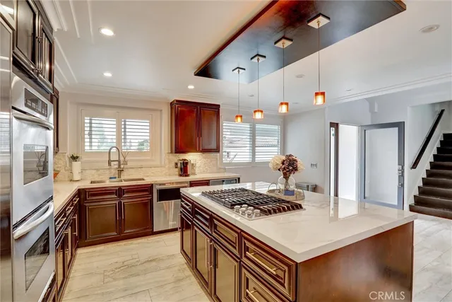 a kitchen with a stove and a sink