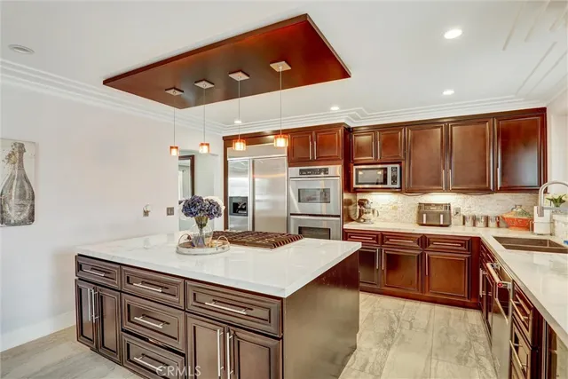 a kitchen with stainless steel appliances granite countertop a sink and cabinets
