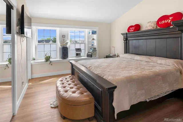 a bedroom with a bed and dresser