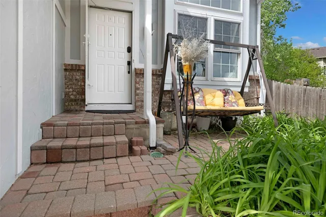 a front view of a house with outdoor seating