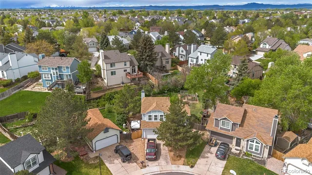 an aerial view of residential house with outdoor space and swimming pool