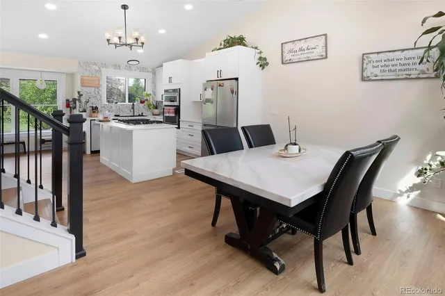 a view of a dining room with furniture and wooden floor