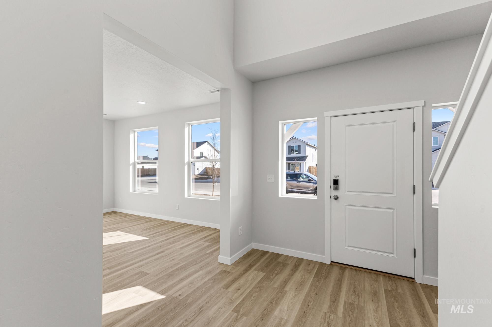 13708 Judson Street Caldwell, ID 83607 - Photo 2 of 29 Entryway featuring light wood finished floors and baseboards