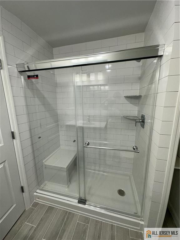3303 Hana Road Edison, NJ 08817 - Photo 41 of 47 a bathroom with a glass shower door