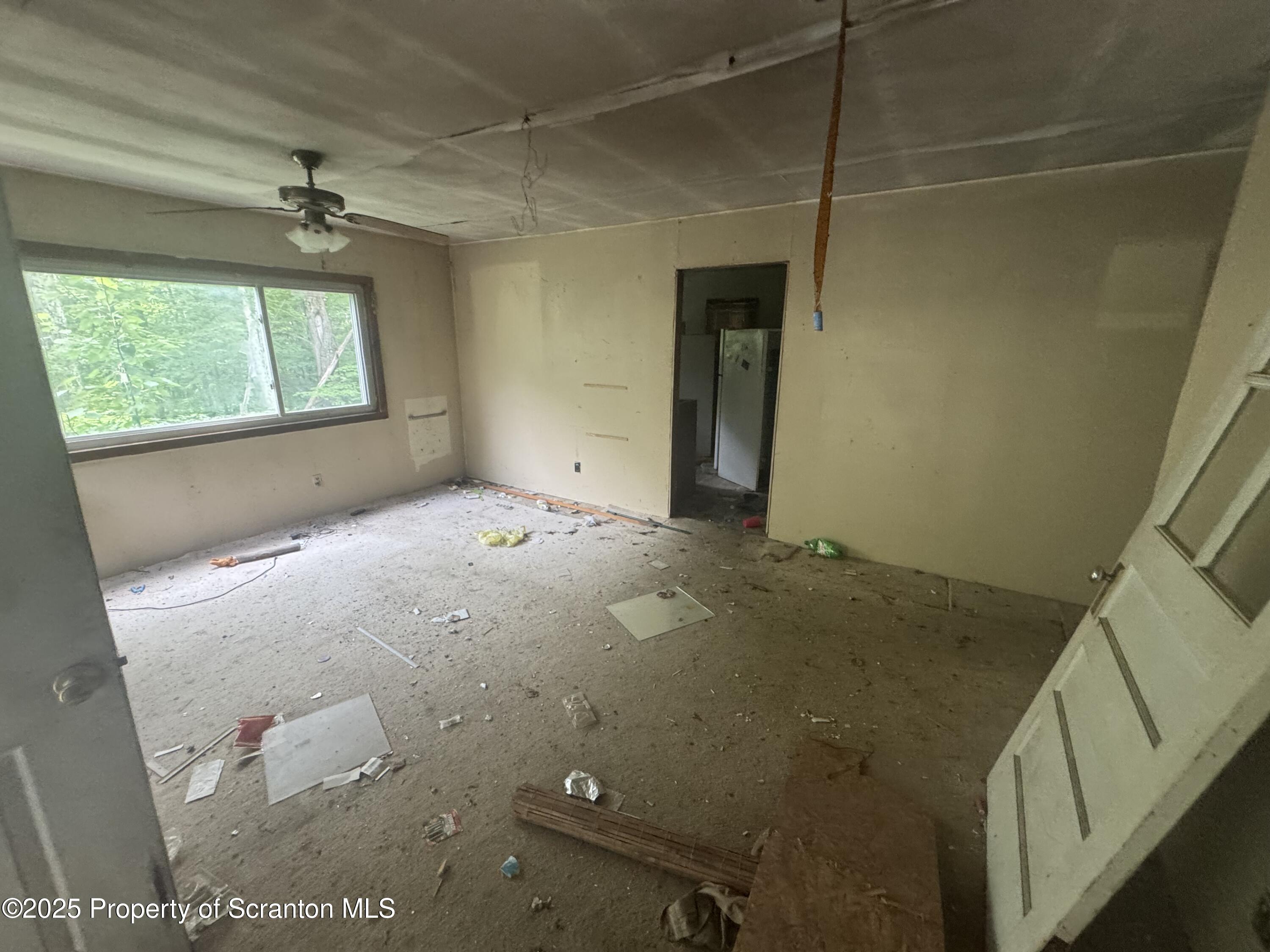 761 Green Road Montrose, PA 18801 - Photo 6 of 11 a view of an empty room with a window