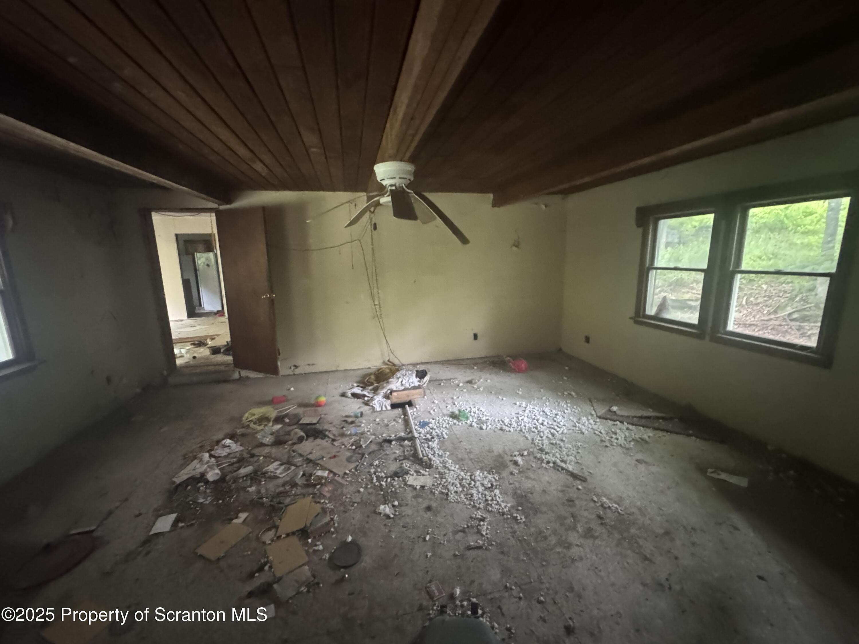 761 Green Road Montrose, PA 18801 - Photo 7 of 11 an empty room with windows