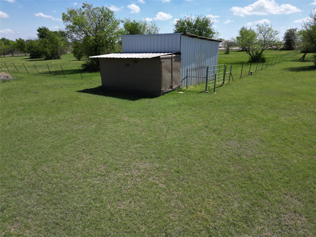 2101 Ridge View Drive Cleburne, TX 76033 - Photo 29 of 31 View of yard featuring a view of rural / pastoral area and a storage unit