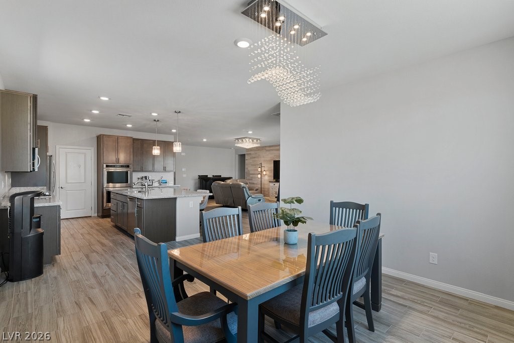4191 Velvet View Street Las Vegas, NV 89129 - Photo 11 of 44 Dining room with light wood-type flooring and recessed lighting