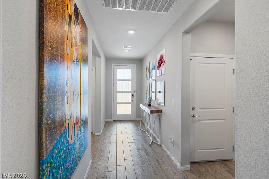 4191 Velvet View Street Las Vegas, NV 89129 - Photo 13 of 44 Doorway featuring wood finish floors and recessed lighting