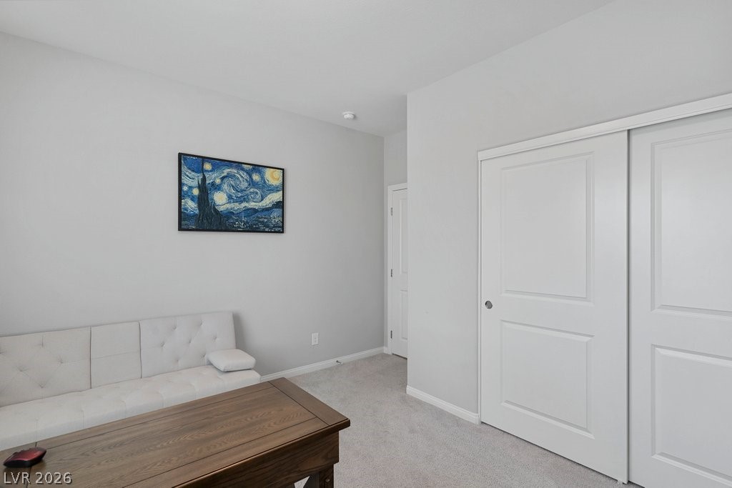 4191 Velvet View Street Las Vegas, NV 89129 - Photo 15 of 44 Sitting room featuring light carpet and baseboards
