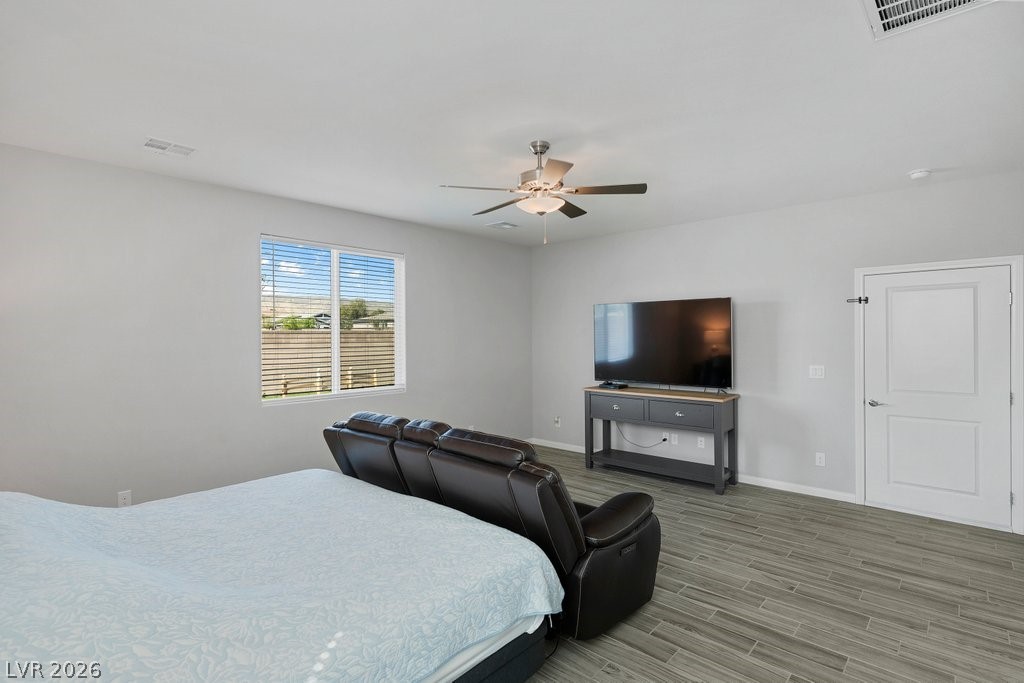 4191 Velvet View Street Las Vegas, NV 89129 - Photo 18 of 44 Bedroom featuring wood finish floors and a ceiling fan